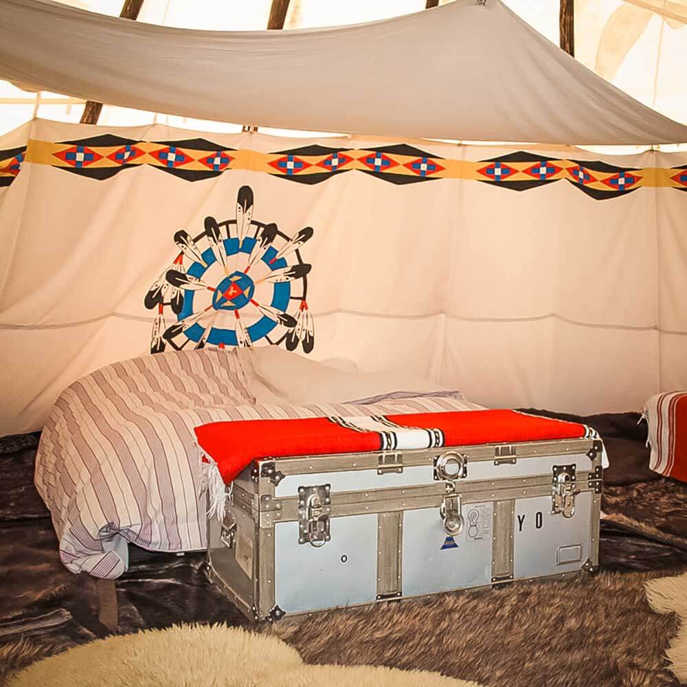 Bed and decor of tipis - East Sussex glamping at Big Sky Tipis